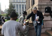 A First Amendment right to feed? Pastor Raymond Redlich hands out water bottles at the New Life Evangelistic Center's weekly giveaway program outside City Hall. (Photo courtesy of Raymond Redlich)