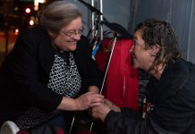 Angel of the Night offers comfort amid pandemic Valerie McEntee speaks with a homeless individual during one of her night walks in San Francisco. (Courtesy of San Francisco Night Ministry)
